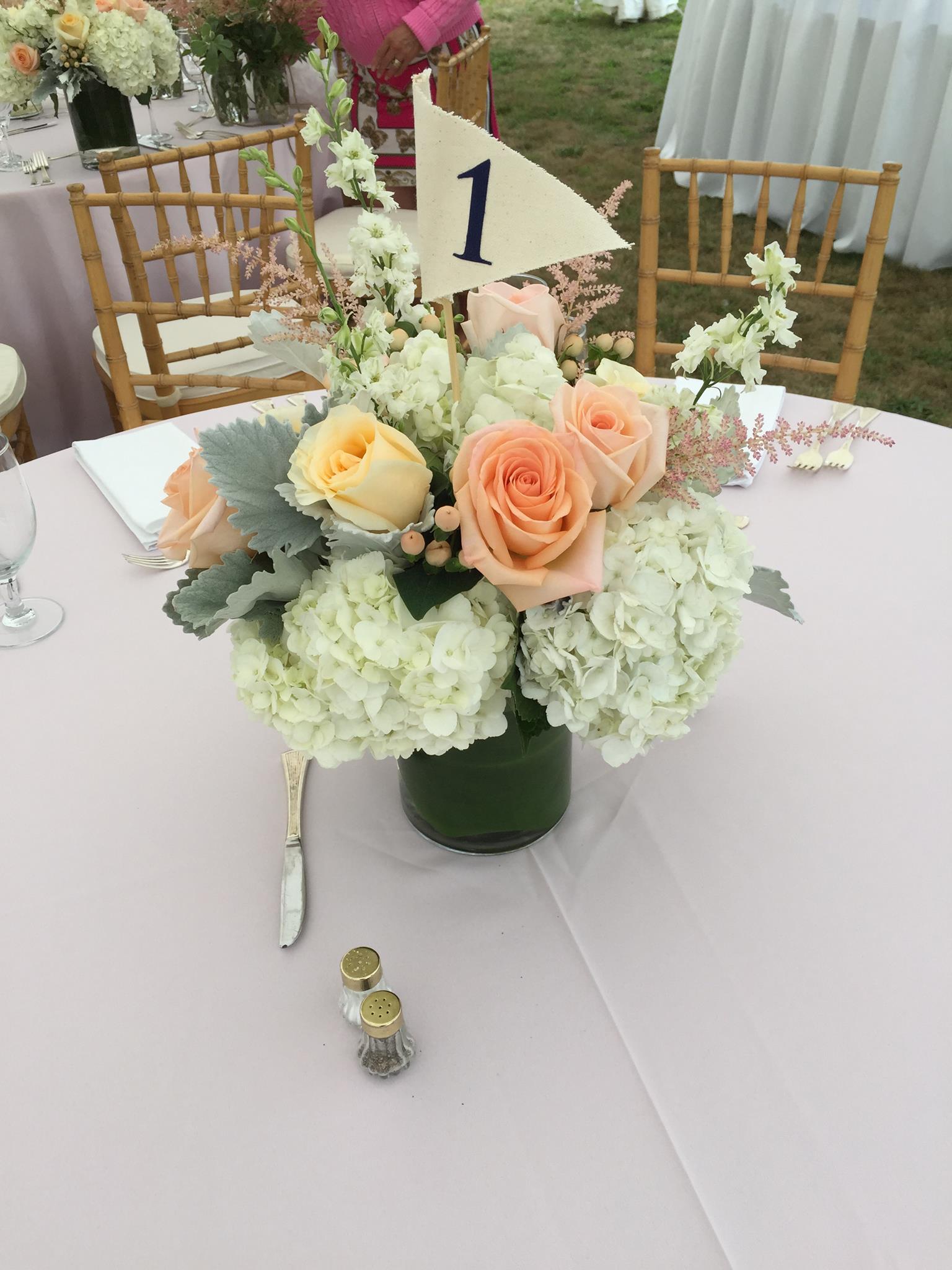Pretty Wedding Centerpiece with Peach and Cream roses and White Hydrangea