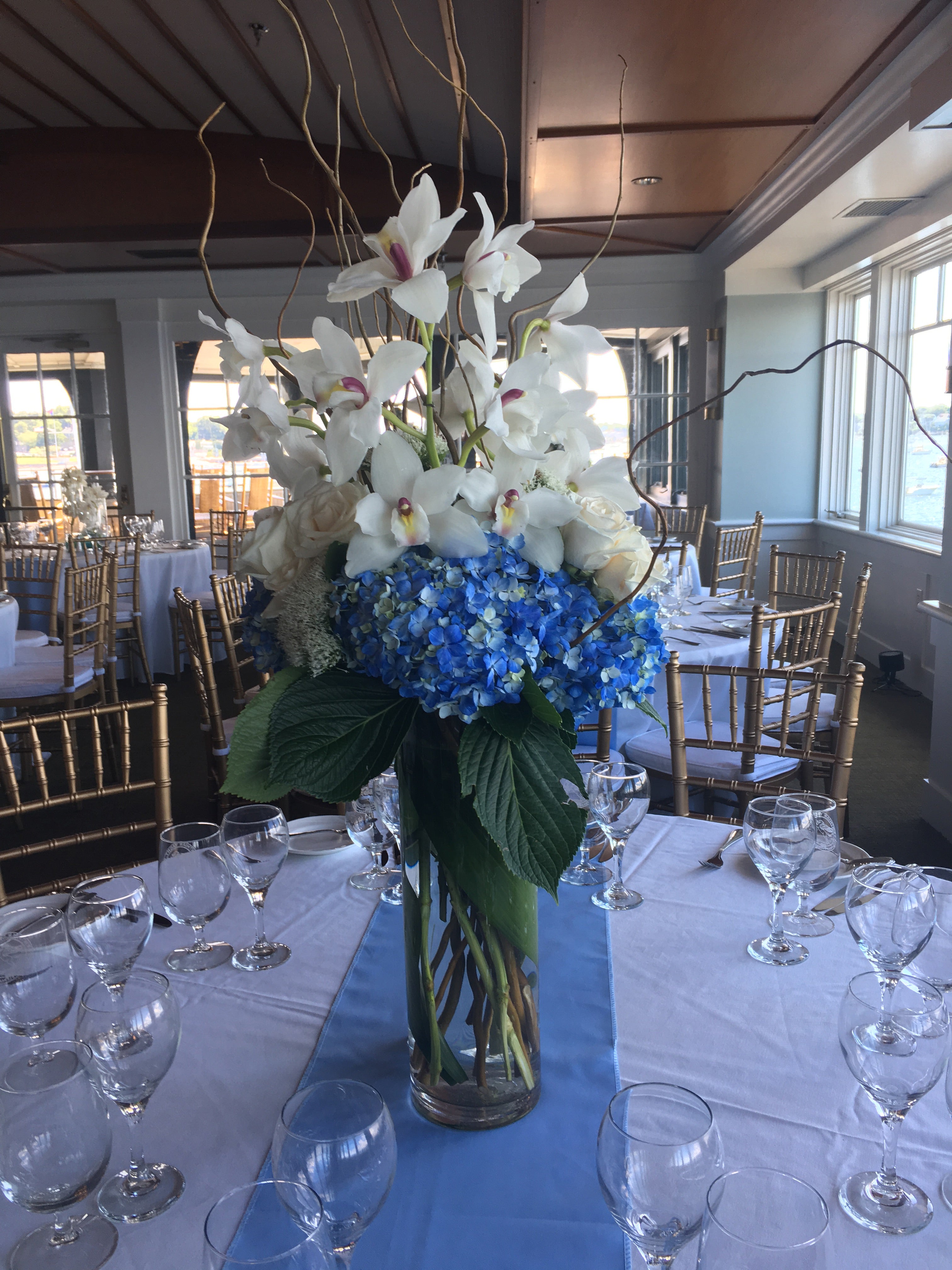 Blue & White Wedding Centerpieces with Cymbidium Orchids and Hydrangeas and Curly Willow